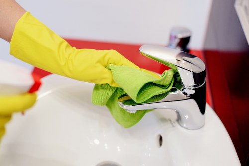Cleaner wearing PPE during a professional cleaning task